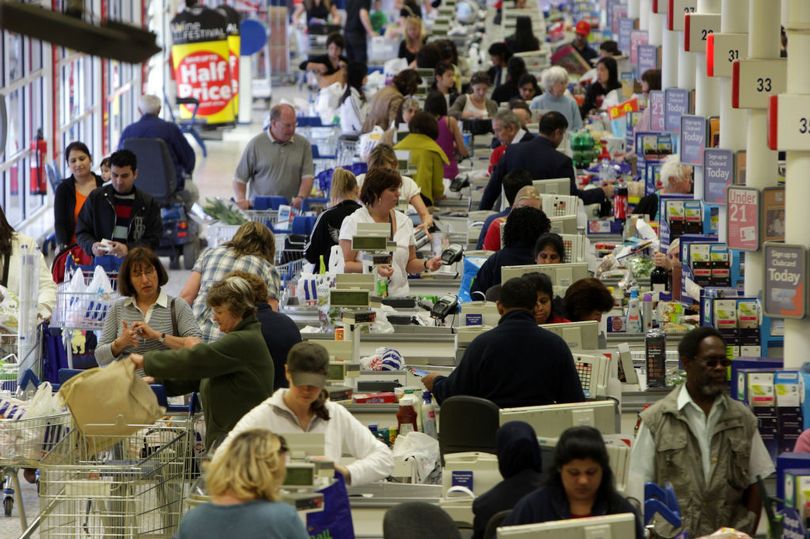 Photo: Shoppers at a busy supermarket (Image: Getty)
